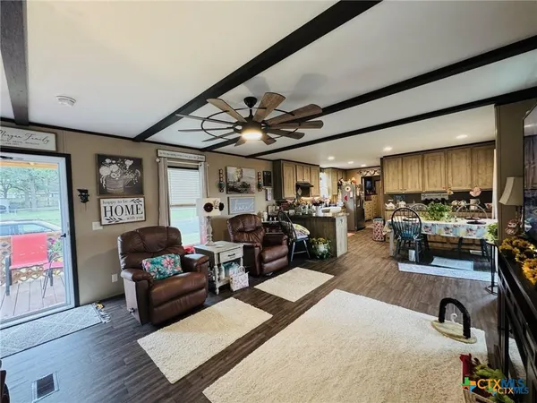 a view of a livingroom with furniture and a livingroom