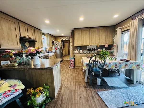 a kitchen with a stove and a refrigerator