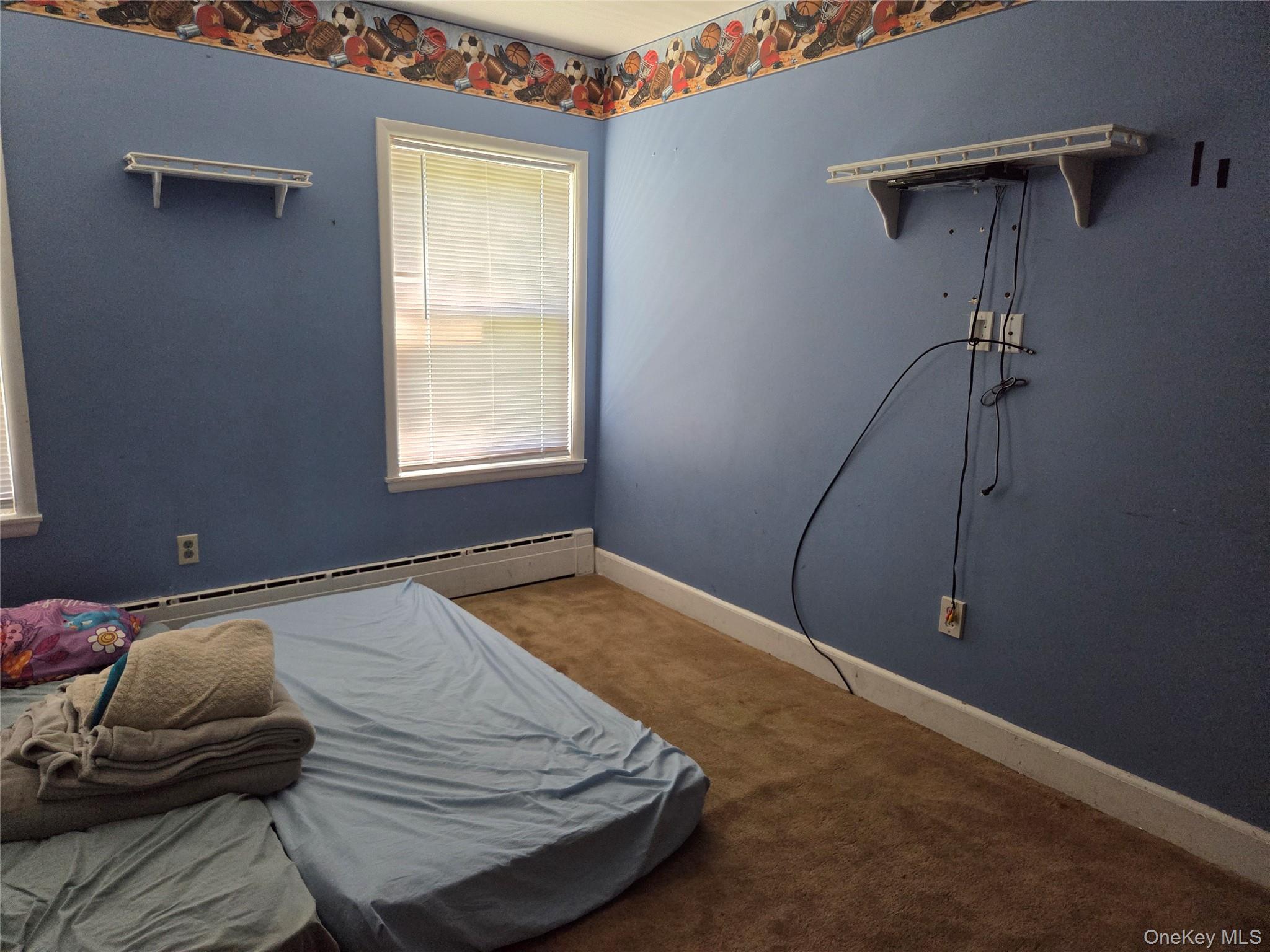 125 Zimmerman Road Loch Sheldrake, NY 12759 - Photo 9 of 43 a room with a bed and wooden floor