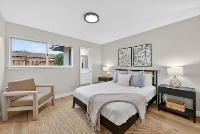 a bedroom with a bed and a chair