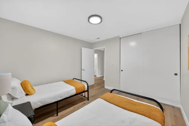 a bedroom with a bed and couch