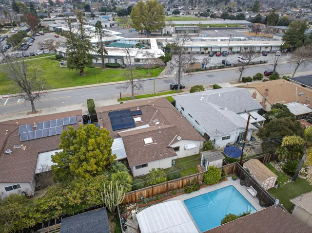 an aerial view of a house with a garden