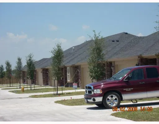 a view of a car parked in front of a building