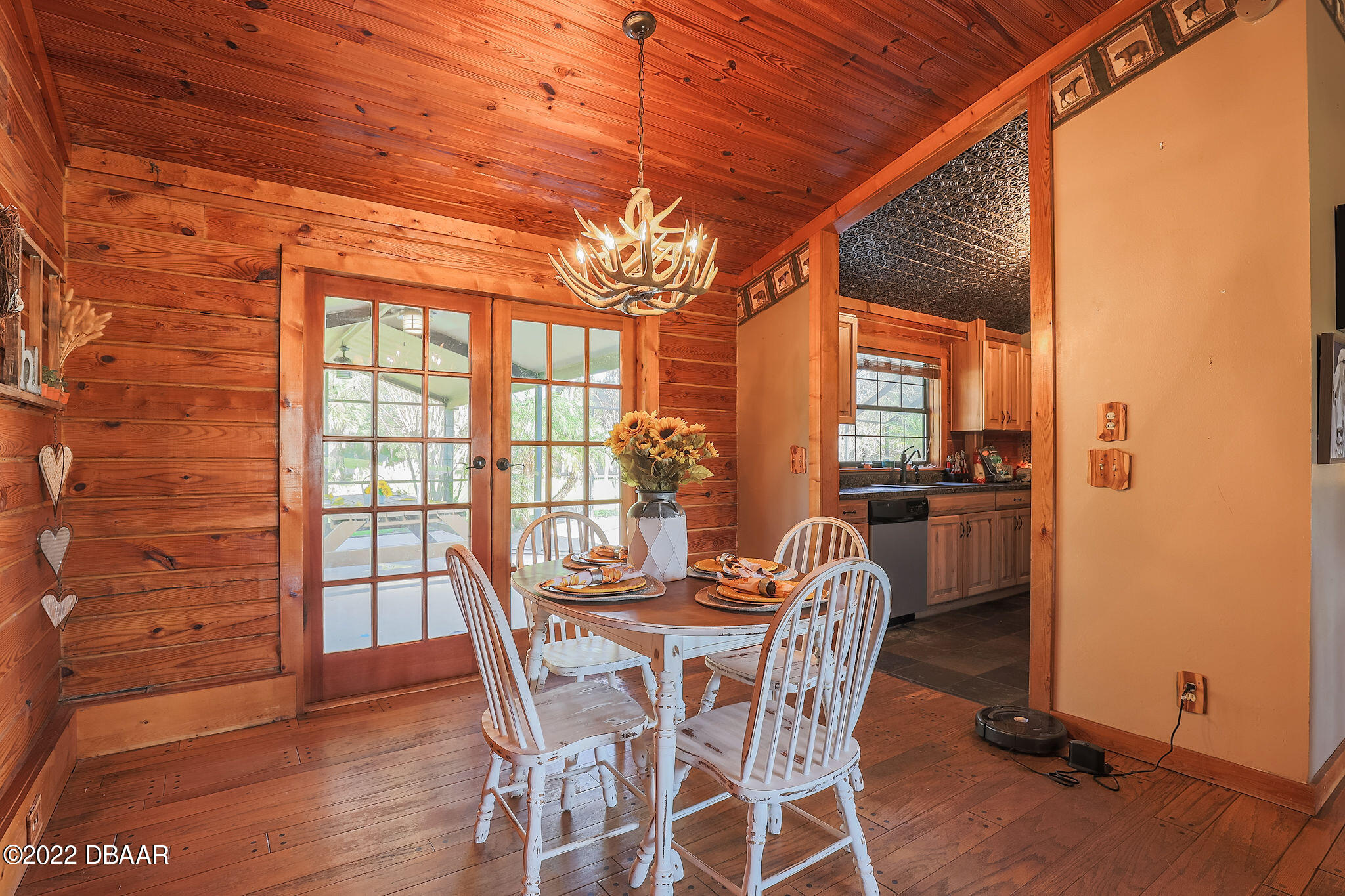 114 Pine Creek Court Ormond Beach, FL 32174 - Photo 14 of 41 a dining room with furniture and wooden floor