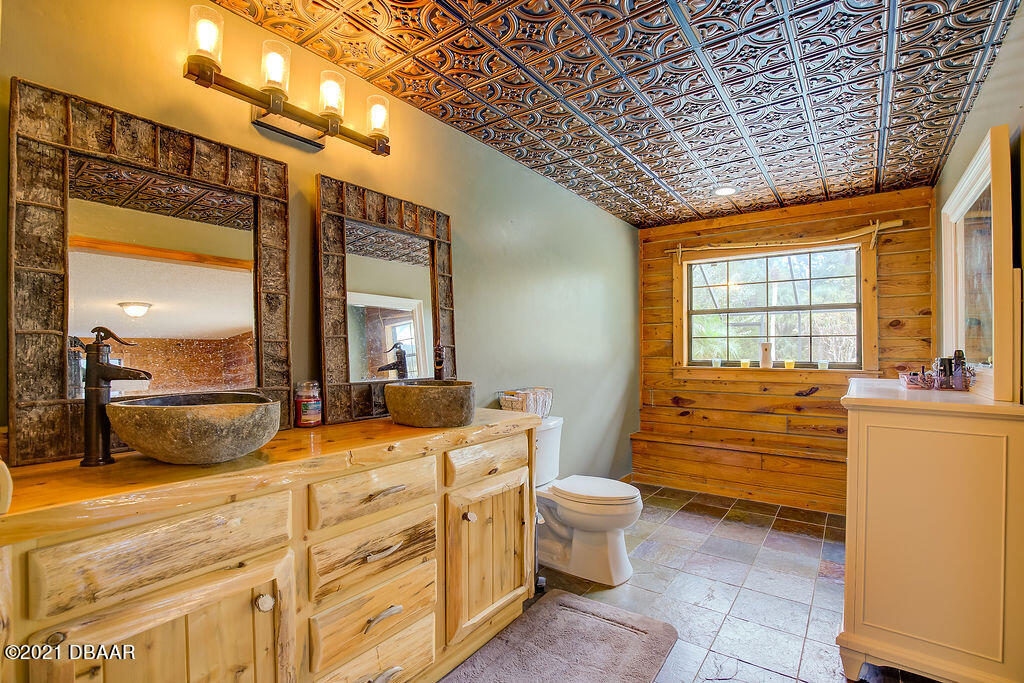 114 Pine Creek Court Ormond Beach, FL 32174 - Photo 26 of 41 a room with painting on the wall and a window