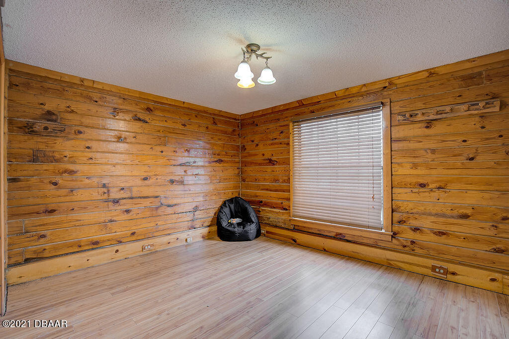 114 Pine Creek Court Ormond Beach, FL 32174 - Photo 31 of 41 a view of a livingroom with wooden floor and a window