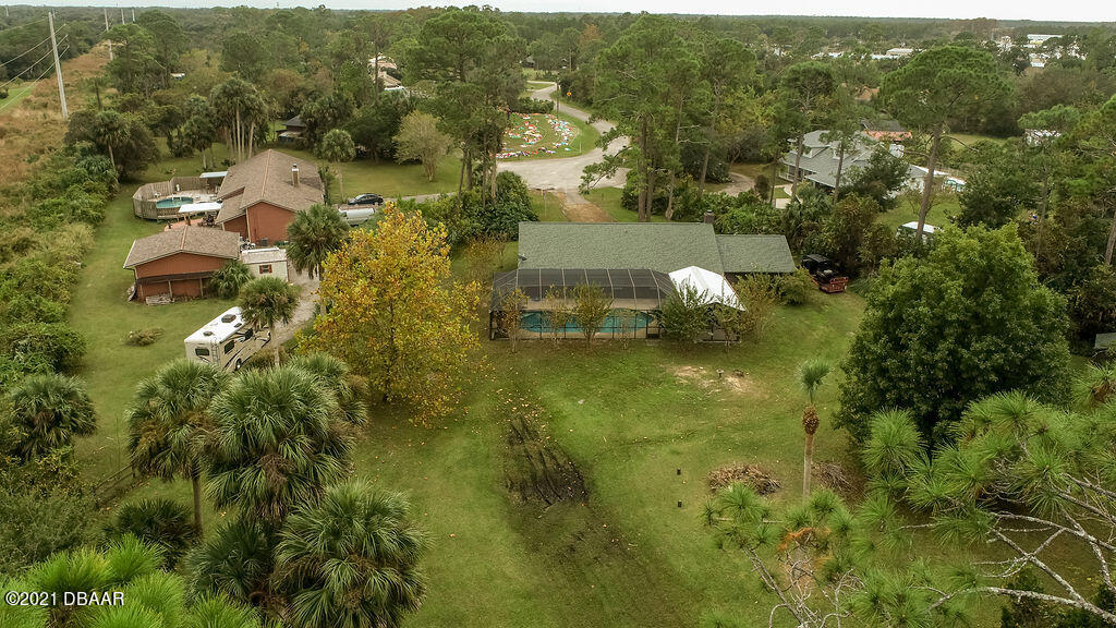 114 Pine Creek Court Ormond Beach, FL 32174 - Photo 40 of 41 an aerial view of residential houses with outdoor space and trees