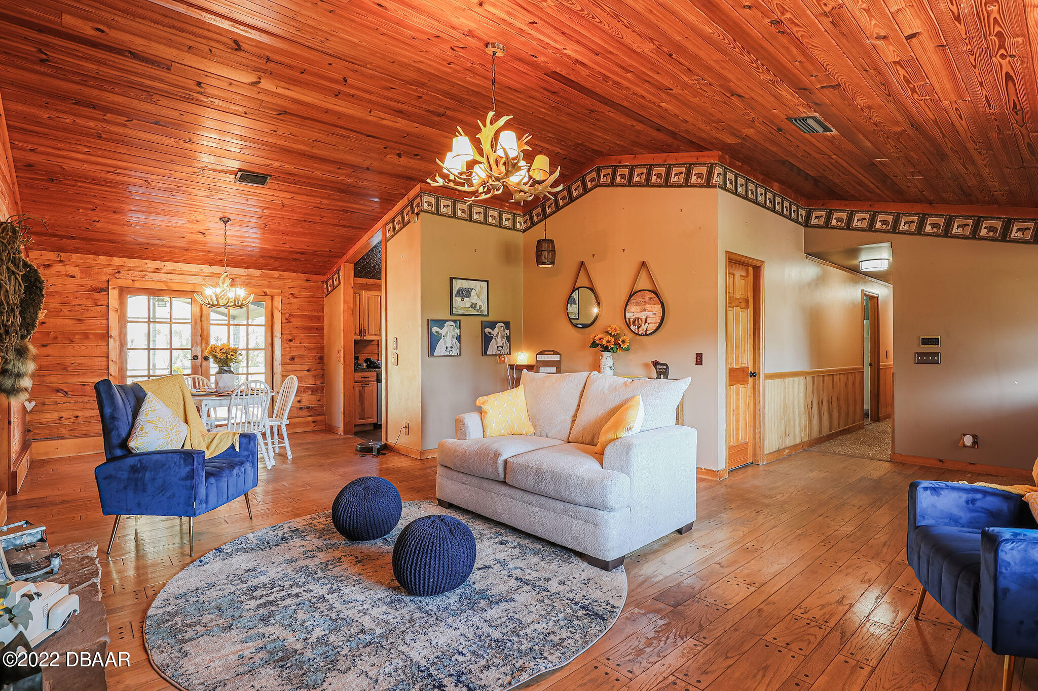 114 Pine Creek Court Ormond Beach, FL 32174 - Photo 5 of 41 a living room with furniture and a chandelier