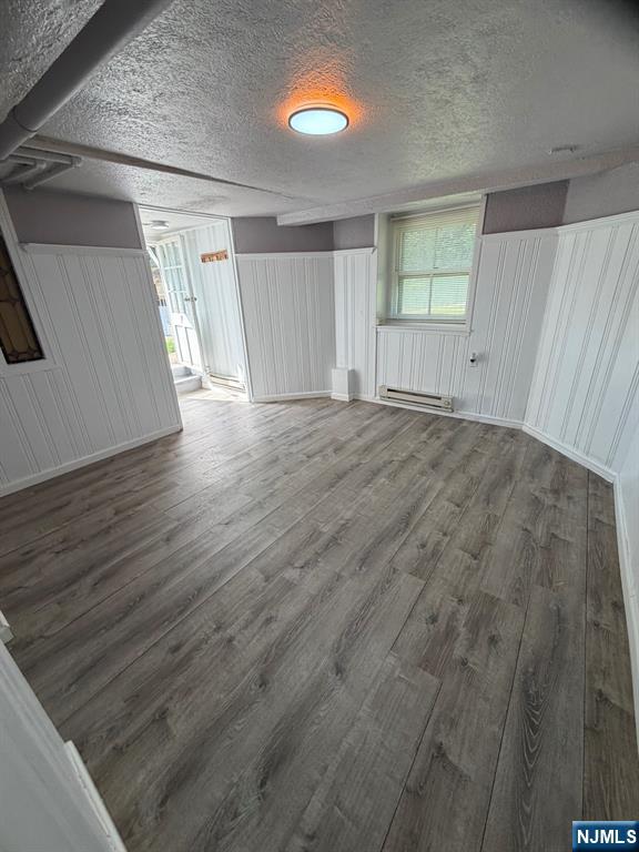 1283 Valley Road, Unit 7 Montclair, NJ 07043 - Photo 16 of 26 an empty room with wooden floor and windows