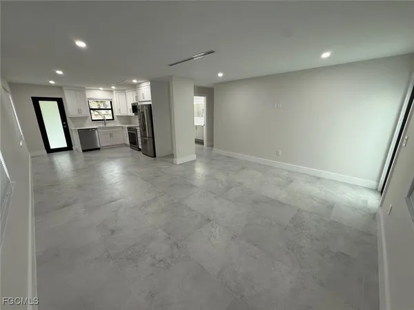 a bathroom with a shower and a sink