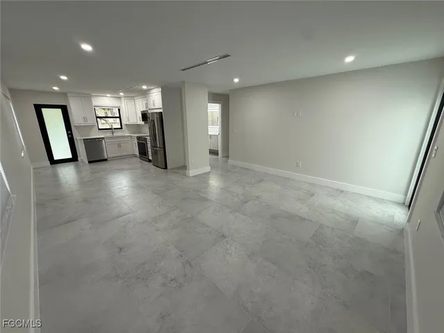a bathroom with a shower and a sink