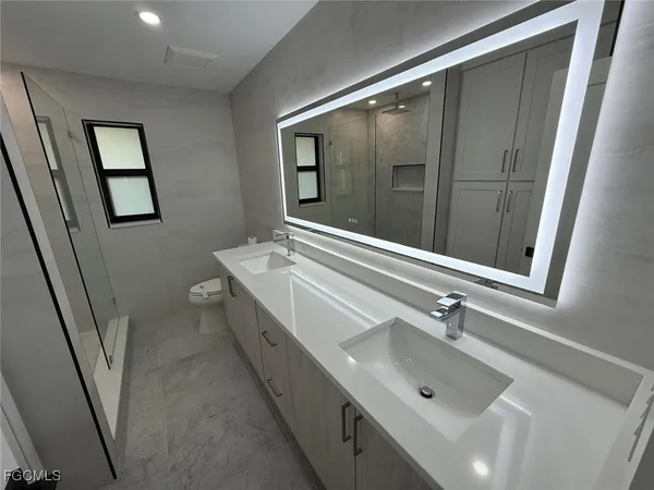 a view of an empty room with a bathroom