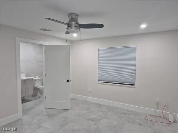 a view of a chandelier fan in a room