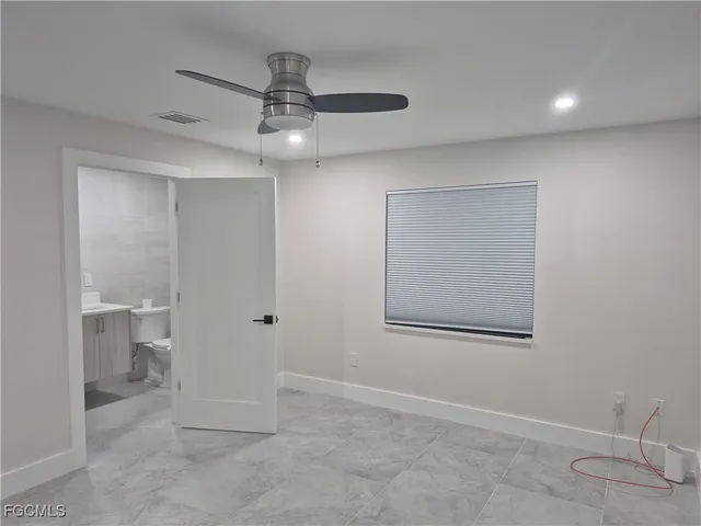 a view of a chandelier fan in a room