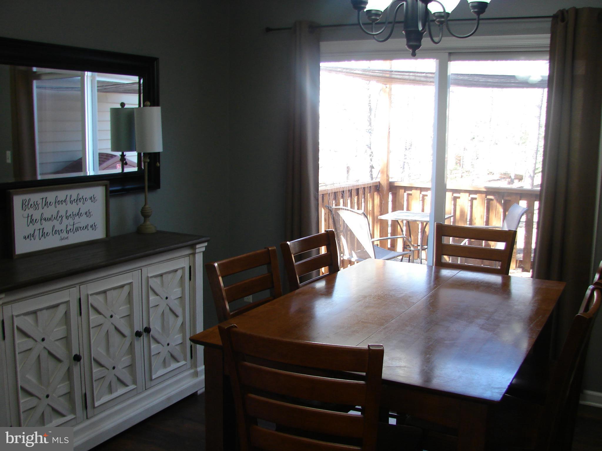 988 Johnswoods Road Lusby, MD 20657 - Photo 14 of 28 Dining Room leads to deck