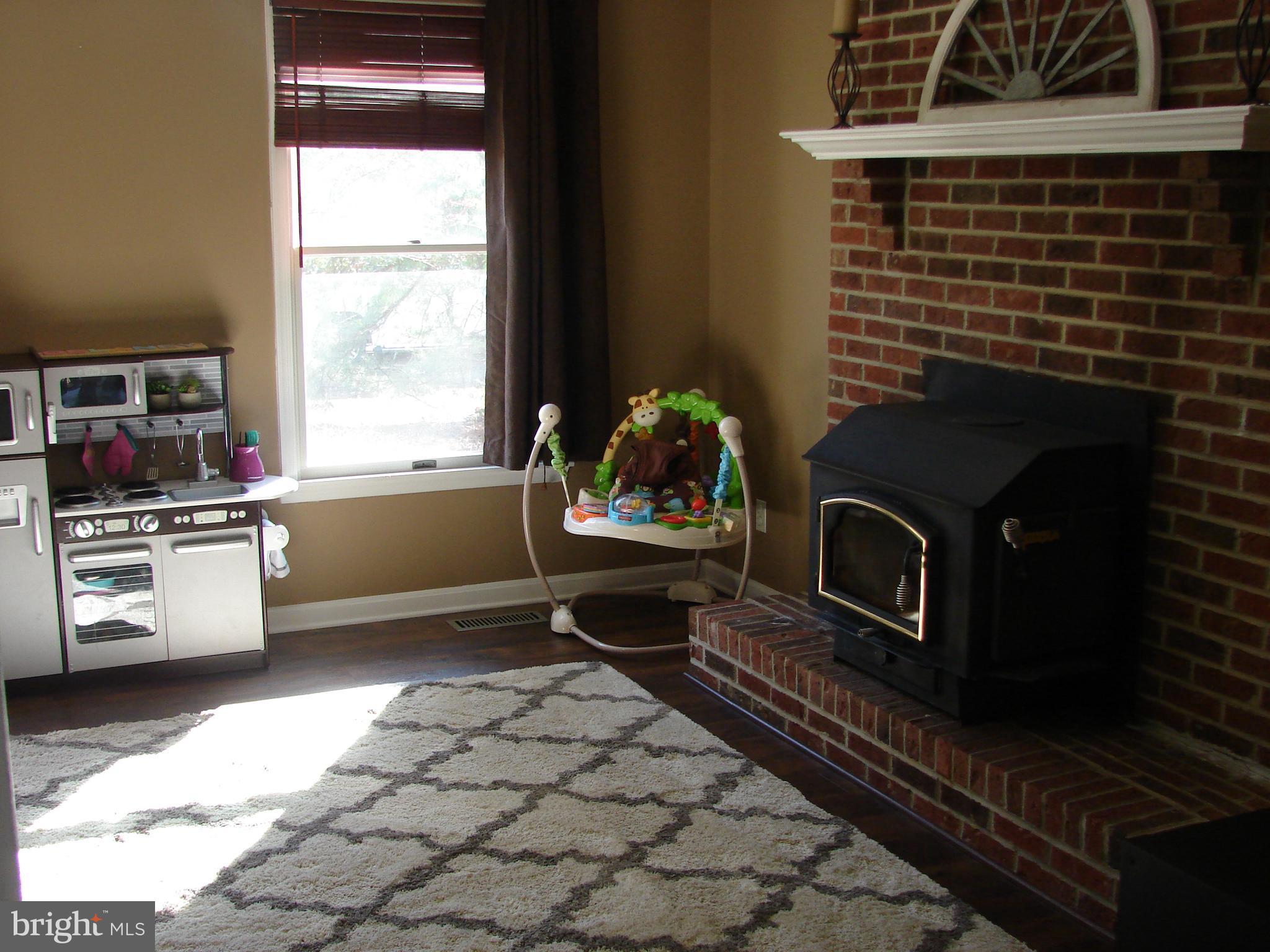 988 Johnswoods Road Lusby, MD 20657 - Photo 8 of 28 Living Room with wood stove insert