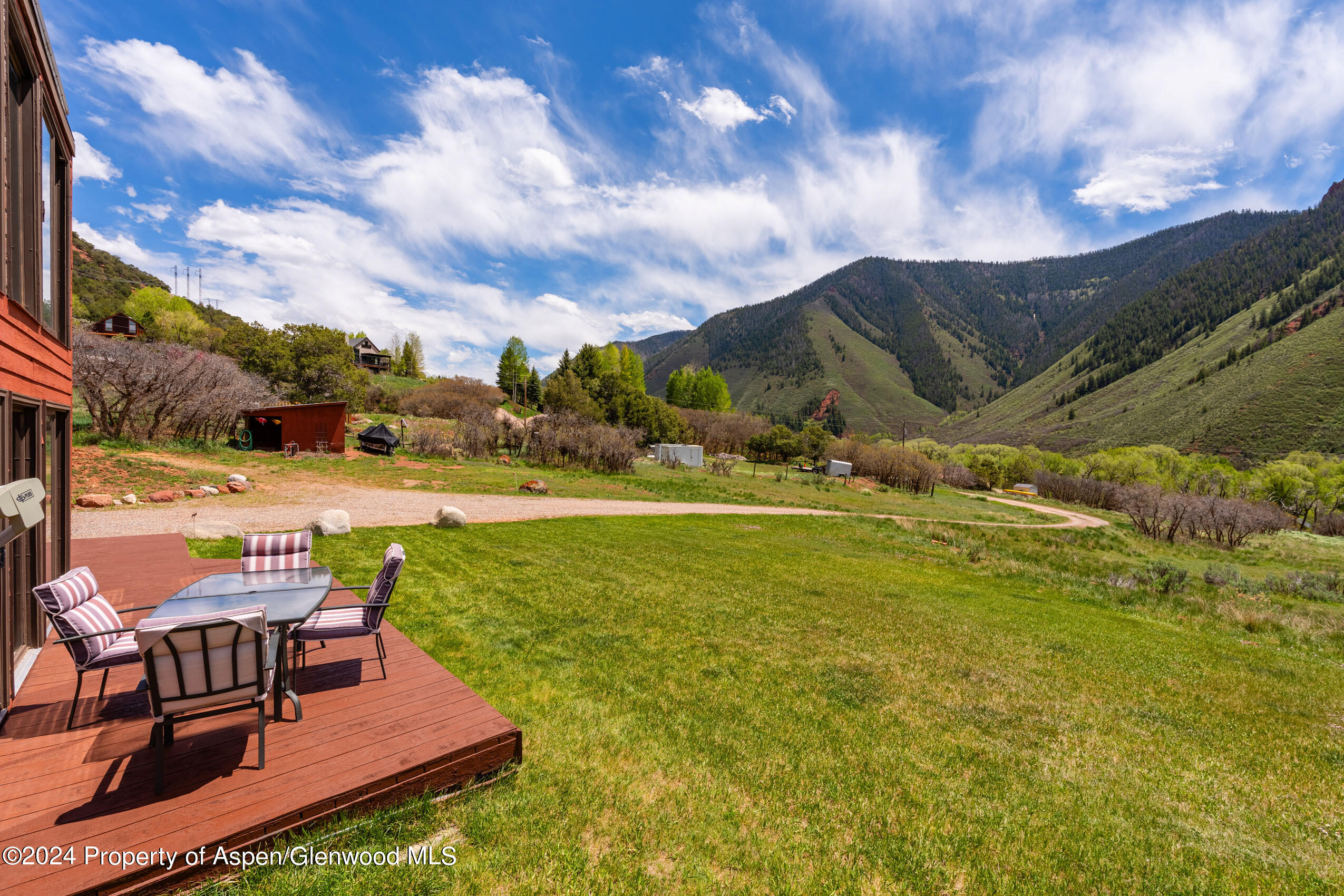 299 Knight Road Basalt, CO 81621 - Photo 14 of 48 a view of a swimming pool with lounge chairs in patio