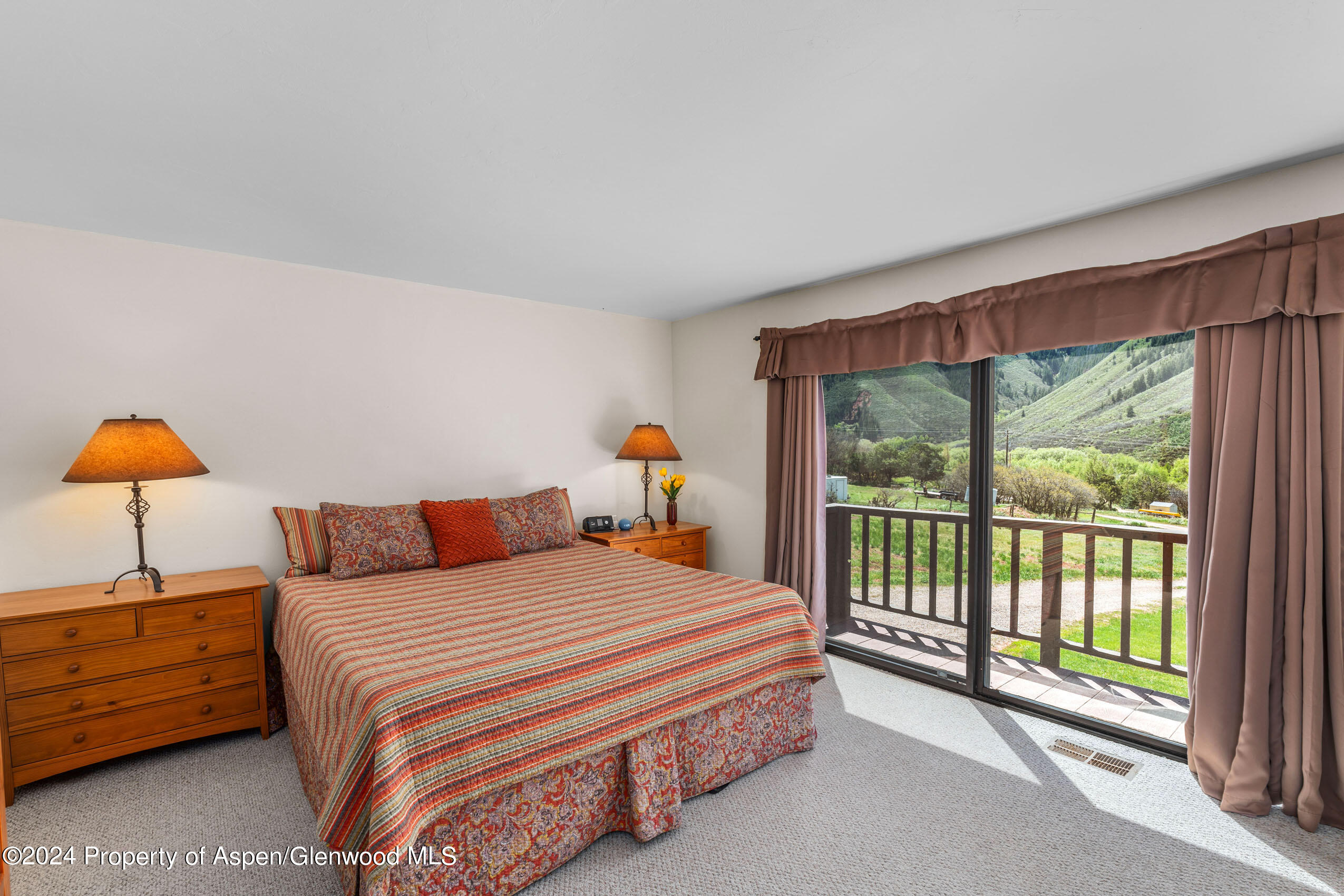 299 Knight Road Basalt, CO 81621 - Photo 18 of 48 a bedroom with a bed and a window