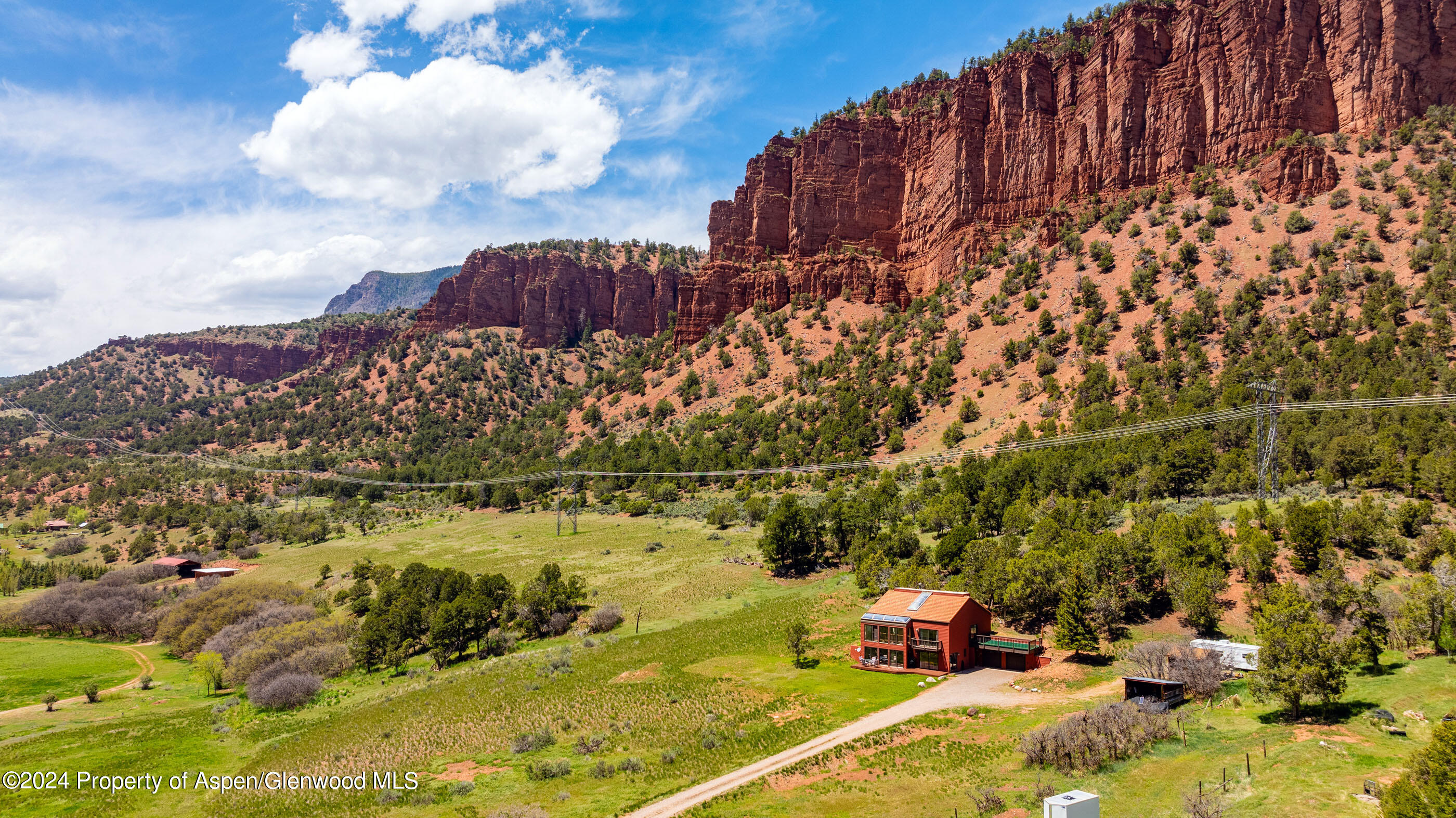 299 Knight Road Basalt, CO 81621 - Photo 44 of 48 a view of a lake with a building in the background