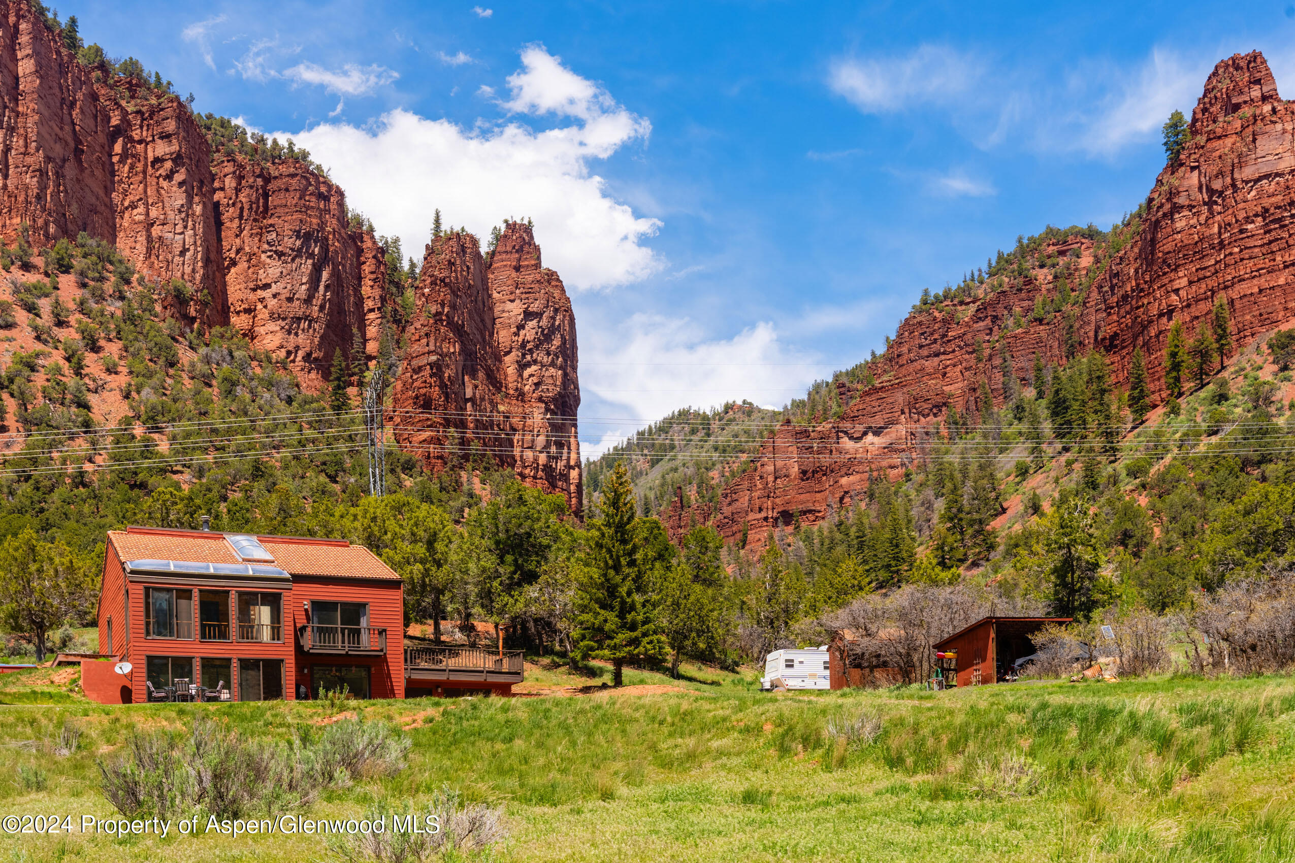 299 Knight Road Basalt, CO 81621 - Photo 5 of 48 a view of a house with a big yard and large trees
