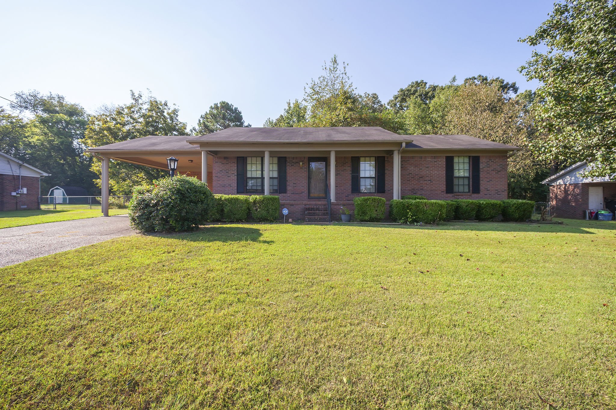 62 Beth Place Jackson, TN 38305 - Photo 1 of 6 a front view of a house with yard and green space