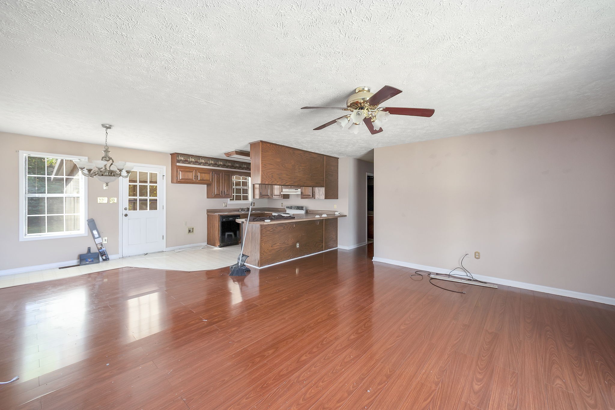 62 Beth Place Jackson, TN 38305 - Photo 2 of 6 a view of a kitchen with wooden floor and a ceiling fan