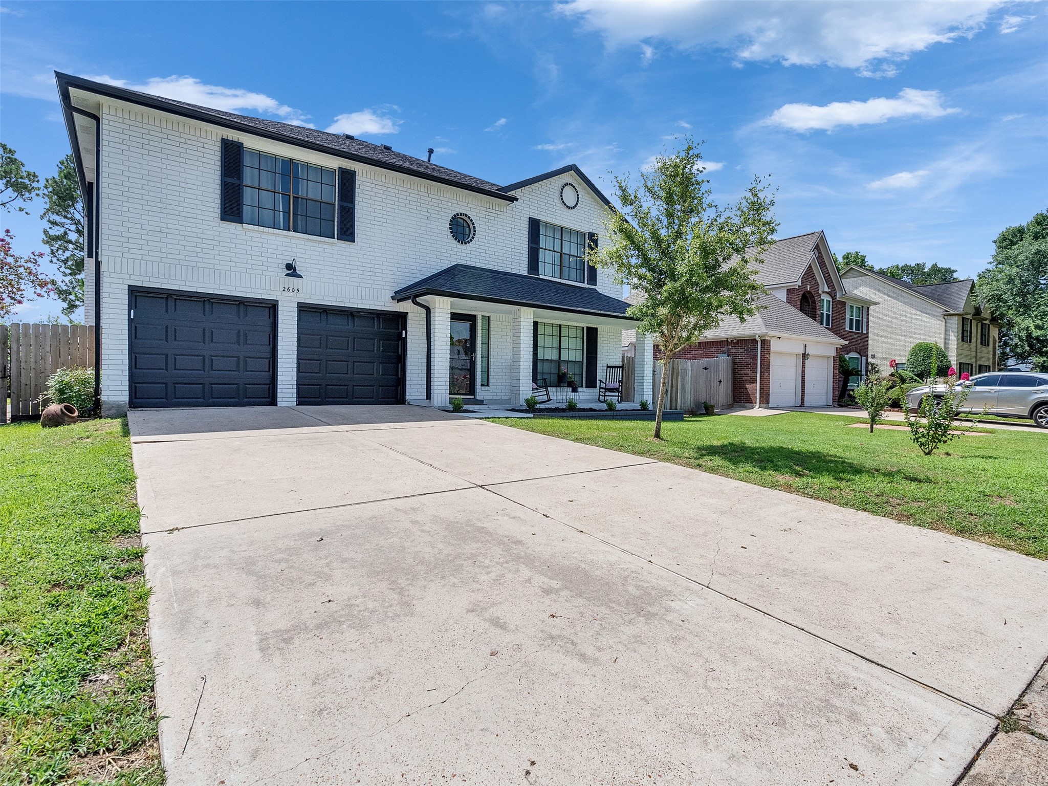 2605 South Mission Circle Friendswood, TX 77546 - Photo 2 of 27 a front view of house with yard and green space