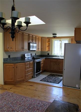 158 Ames Road Hampden, MA 01036 - Photo 12 of 30 a kitchen with kitchen island granite countertop a sink cabinets and stainless steel appliances