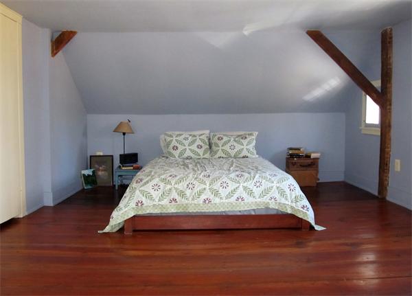 158 Ames Road Hampden, MA 01036 - Photo 19 of 30 a bed sitting in a bedroom next to a window with wooden floor