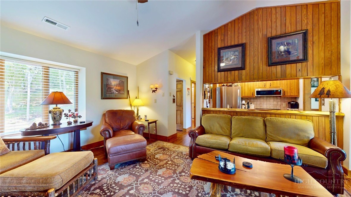 250 Ridgeview Road, Unit 43 Sugar Mountain, NC 28604 - Photo 6 of 21 a living room with furniture and a window