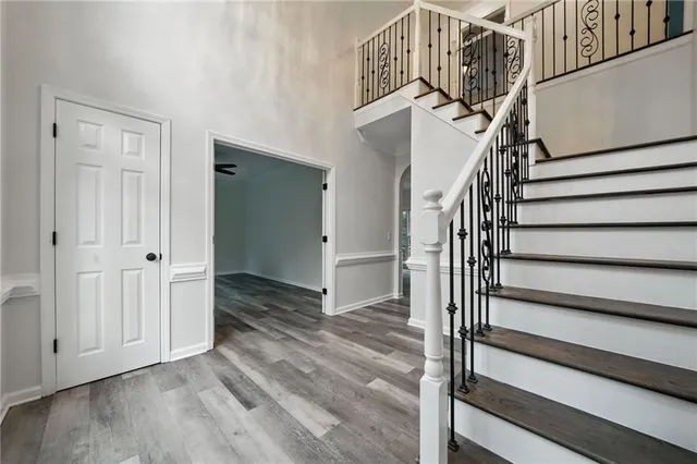 a bathroom with a tub a sink and mirror