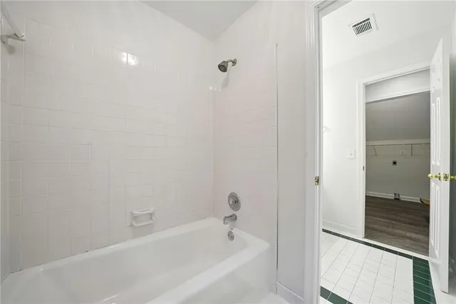 a bathroom with double sink and a mirror