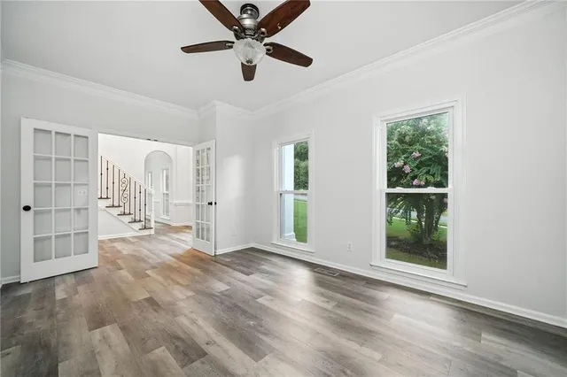 a kitchen with granite countertop a refrigerator and a stove top oven