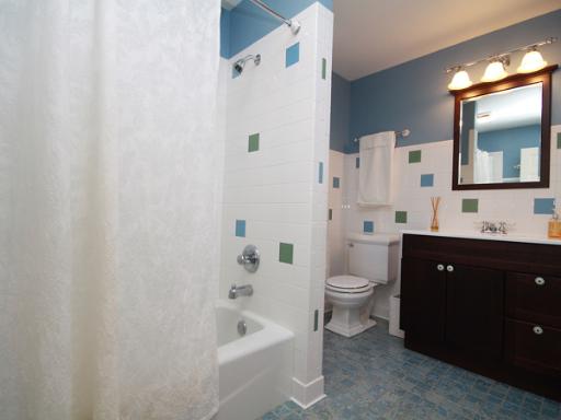 6N755 Murray Road St. Charles, IL 60175 - Photo 13 of 16 a bathroom with a double vanity sink toilet and shower