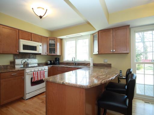 6N755 Murray Road St. Charles, IL 60175 - Photo 6 of 16 a kitchen with stainless steel appliances granite countertop a sink a stove a microwave a refrigerator cabinets and a window