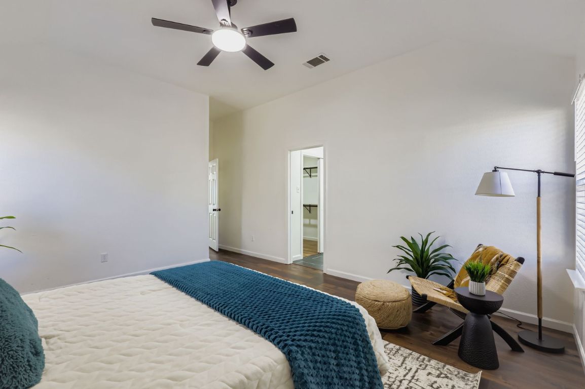 108 Susana Drive Georgetown, TX 78628 - Photo 13 of 26 a bedroom with bed and a potted plant