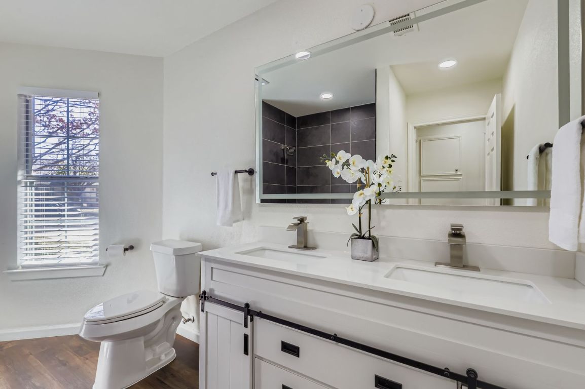 108 Susana Drive Georgetown, TX 78628 - Photo 19 of 26 a bathroom with a sink a toilet and a mirror