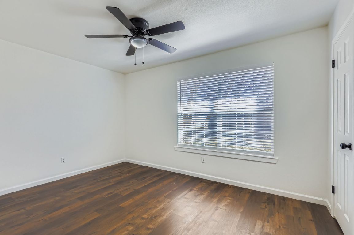 108 Susana Drive Georgetown, TX 78628 - Photo 20 of 26 a view of an empty room with wooden floor and a window