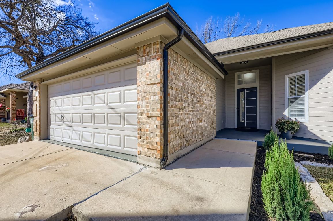 108 Susana Drive Georgetown, TX 78628 - Photo 2 of 26 a front view of a house with a yard