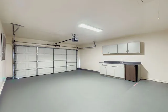 a view of a kitchen with a sink and dishwasher