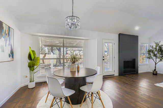 a view of a dining room with furniture window and wooden floor