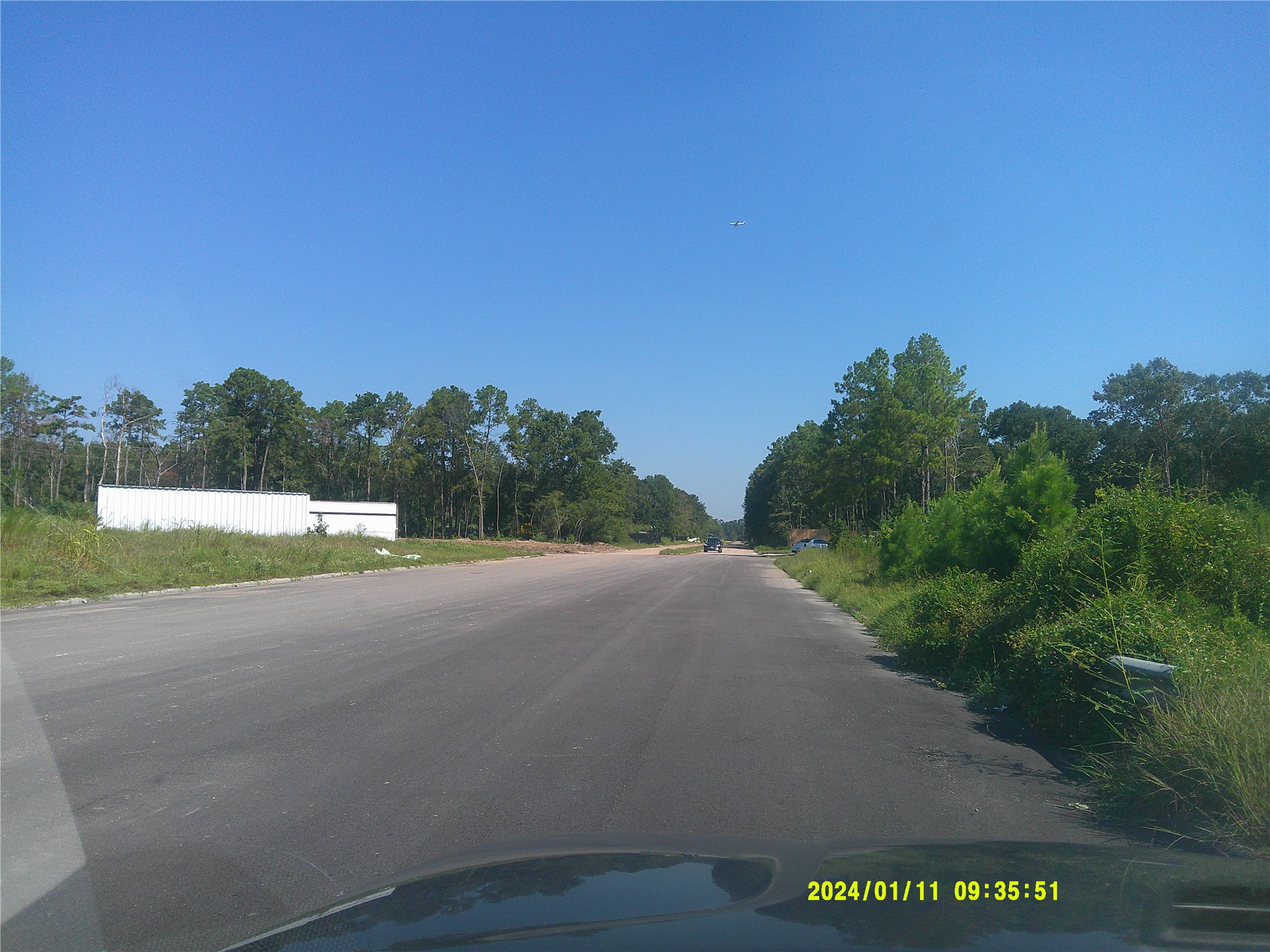 0 Baltic Drive Humble, TX 77346 - Photo 10 of 11 a view of a road with a big yard