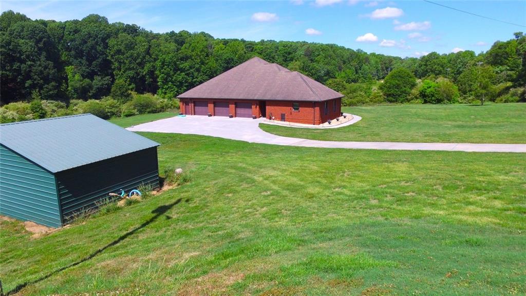 4113 Ledan Extension Gainesville, GA 30506 - Photo 22 of 195 a aerial view of a house with swimming pool and a yard