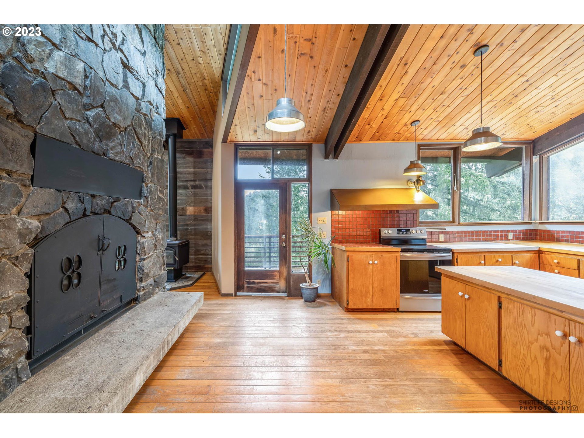 27313 Briggs Hill Road Eugene, OR 97405 - Photo 12 of 48 a kitchen with stainless steel appliances granite countertop a stove a sink and a microwave