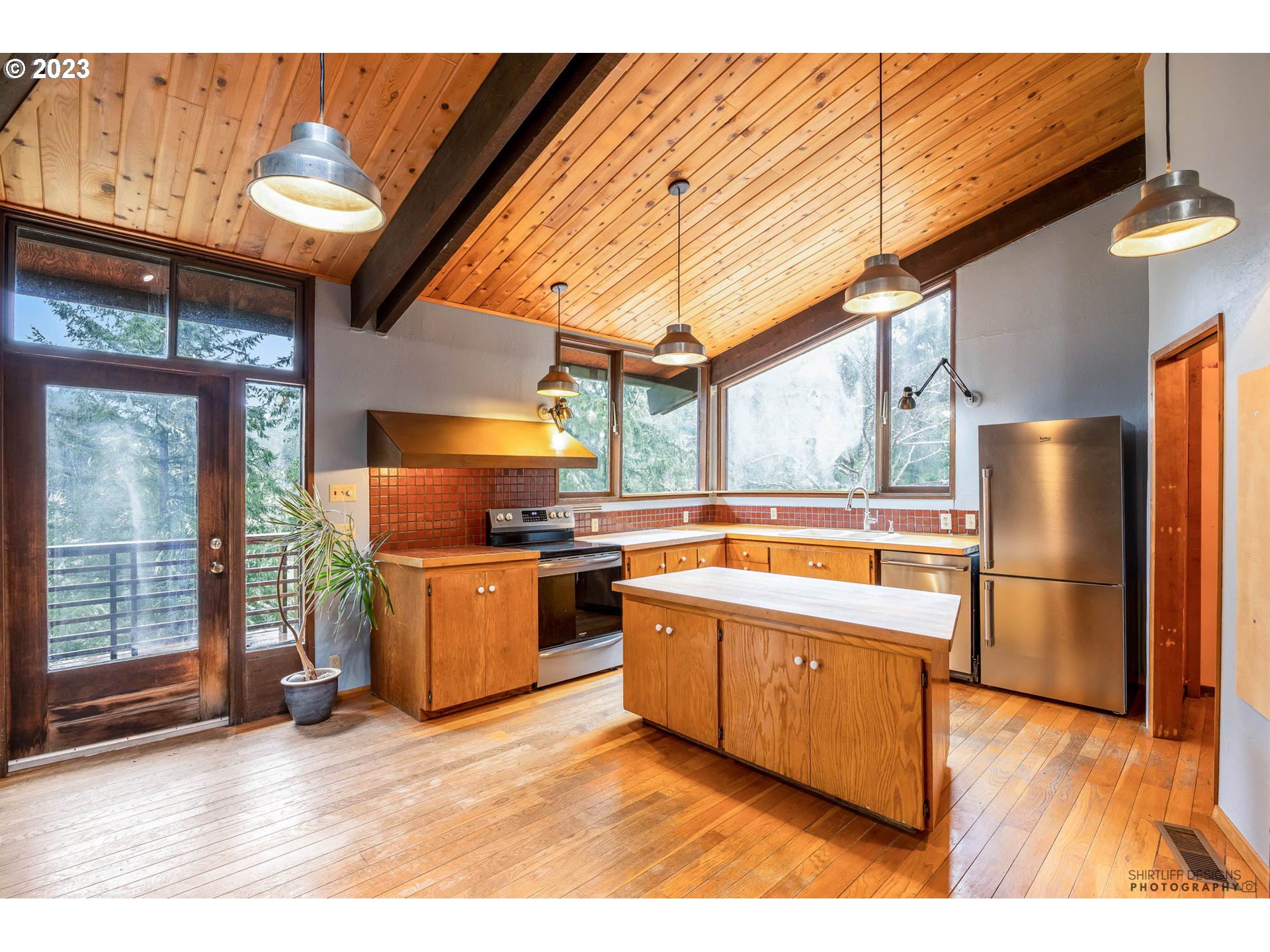 27313 Briggs Hill Road Eugene, OR 97405 - Photo 14 of 48 a kitchen with stainless steel appliances granite countertop a sink a stove and a refrigerator