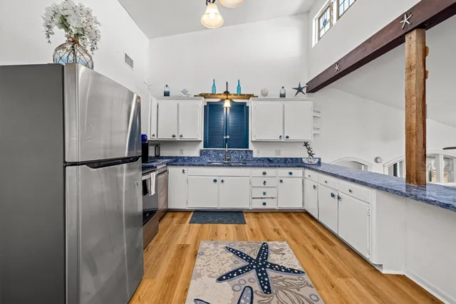 a kitchen with a sink and cabinets