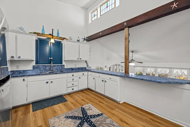 a living room with furniture a table and decor
