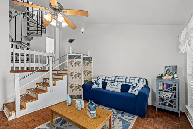 a bedroom with furniture and a chandelier