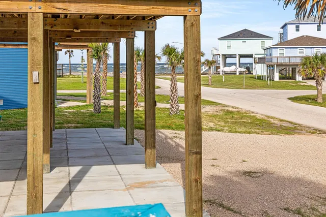 a view of a chairs and table on the balcony