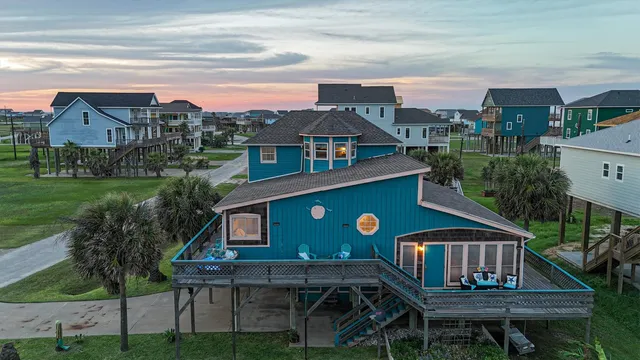 a front view of a house with yard outdoor seating and city view